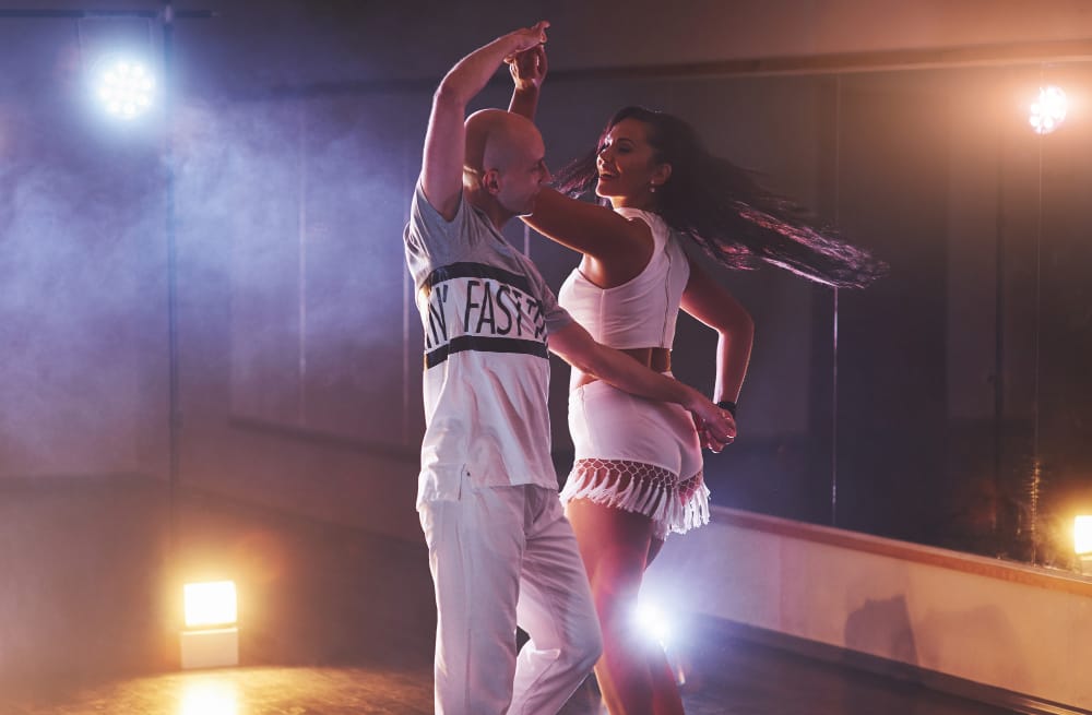 happy couple dancing salsa